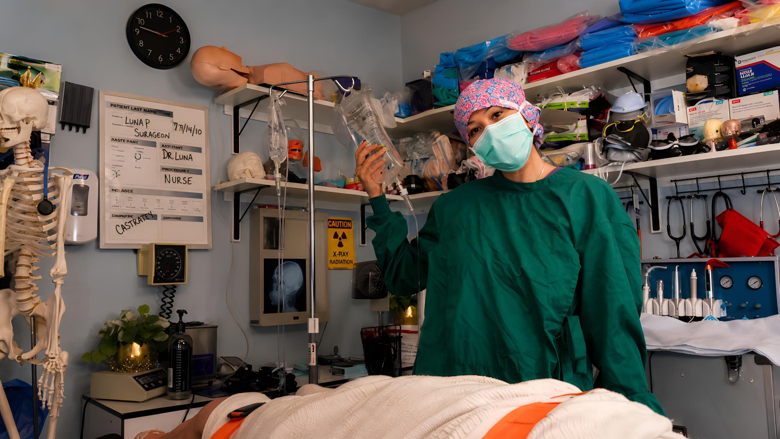 Luna in dirty room wearing surgical gown grimy BDSM environment